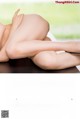 A magazine page with a picture of a naked woman.
